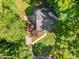 An aerial shot of a landscaped property showcasing a paved driveway and walkways at 1104 Berwyn Way, Raleigh, NC 27615