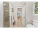 Bathroom featuring tile flooring, a glass enclosed shower, and a doorway to the bedroom at 1104 Berwyn Way, Raleigh, NC 27615