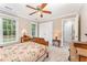 Bedroom featuring a wood bed frame, neutral walls, carpet, and two windows at 1104 Berwyn Way, Raleigh, NC 27615