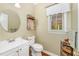 Cozy half bathroom featuring a pedestal sink and warm tones at 1104 Berwyn Way, Raleigh, NC 27615