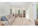 Bright living room featuring large windows and plush seating at 1104 Berwyn Way, Raleigh, NC 27615