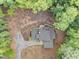 A bird's eye view of a beautiful property with stone patio and a long driveway at 1115 Trailwood Dr, Raleigh, NC 27606