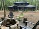 Charming backyard with cozy fire pit and comfortable seating, perfect for enjoying outdoor gatherings at 1115 Trailwood Dr, Raleigh, NC 27606