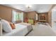 Cozy bedroom with natural light, a comfortable bed, and a calm, inviting ambiance at 1115 Trailwood Dr, Raleigh, NC 27606