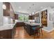 Stylish kitchen featuring a large island, wood cabinetry, and stainless steel appliances with a modern design at 1115 Trailwood Dr, Raleigh, NC 27606