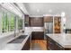 Contemporary kitchen featuring stainless steel appliances, granite countertops, and a large window at 1115 Trailwood Dr, Raleigh, NC 27606