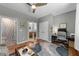 Versatile living room leading to a bathroom and bedroom, creating a seamless flow at 1115 Trailwood Dr, Raleigh, NC 27606