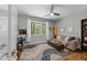 Comfortable office space with a large window, desk, and sofa, perfect for work or relaxation at 1115 Trailwood Dr, Raleigh, NC 27606