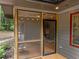 Inviting screened-in porch area showing outdoor living and natural light at 1115 Trailwood Dr, Raleigh, NC 27606