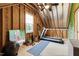 Finished attic space with exposed beams and workout equipment, ideal for a home gym at 1205 Quincy Cottage Rd, Hillsborough, NC 27278