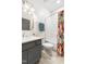 Bathroom featuring a tub with shower and blue accents at 1205 Quincy Cottage Rd, Hillsborough, NC 27278