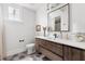 Modern bathroom with a wooden vanity, white sink, and stylish hexagonal floor tiles at 1205 Quincy Cottage Rd, Hillsborough, NC 27278