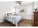 Relaxing bedroom with hardwood floors, neutral colors, and bright, shuttered windows at 1205 Quincy Cottage Rd, Hillsborough, NC 27278