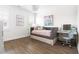 Bright bedroom featuring hardwood floors, a daybed, and a modern vanity area at 1205 Quincy Cottage Rd, Hillsborough, NC 27278