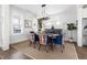 Bright dining room with stylish chairs, a round table, and large windows at 1205 Quincy Cottage Rd, Hillsborough, NC 27278