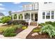 Beautiful two-story home featuring a welcoming front porch with landscaped garden beds at 1205 Quincy Cottage Rd, Hillsborough, NC 27278