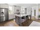 Modern kitchen featuring a large island, stainless steel appliances, and ample counter space at 1205 Quincy Cottage Rd, Hillsborough, NC 27278
