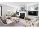 Spacious living room with a fireplace, a flat screen tv, and stylish furniture at 1205 Quincy Cottage Rd, Hillsborough, NC 27278