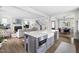 Open concept living room boasts hardwood floors, recessed lighting, and seamless flow to the dining room and kitchen at 1205 Quincy Cottage Rd, Hillsborough, NC 27278