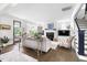 Bright living room with hardwood floors, a fireplace, a flat screen tv, and plenty of natural light at 1205 Quincy Cottage Rd, Hillsborough, NC 27278