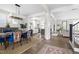 Open living space featuring dining area, kitchen, hardwood floors, and natural light at 1205 Quincy Cottage Rd, Hillsborough, NC 27278