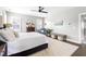 Bright bedroom with a bed, dark wood dresser, and large windows providing plenty of natural light at 1205 Quincy Cottage Rd, Hillsborough, NC 27278