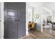 Hallway with a small office nook showcasing grey doors and trim at 1205 Quincy Cottage Rd, Hillsborough, NC 27278