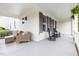 Inviting front porch with seating and rocking chairs, plus stylish gray window shutters at 1205 Quincy Cottage Rd, Hillsborough, NC 27278