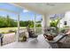Inviting screened porch with comfortable seating and views of the backyard at 1205 Quincy Cottage Rd, Hillsborough, NC 27278