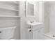 Bright bathroom with single vanity, stand up shower, and modern fixtures at 1209 Maple Ave, Apex, NC 27502