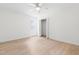 Bright bedroom with ample sunlight, ceiling fan, and closet at 1209 Maple Ave, Apex, NC 27502