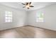Bright bedroom with ample sunlight and ceiling fan at 1209 Maple Ave, Apex, NC 27502