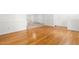 View of a dining room showcasing hardwood floors and direct access to a bright open kitchen space at 1209 Maple Ave, Apex, NC 27502