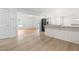 Bright kitchen with stainless steel appliances connects seamlessly with open living and dining areas for modern living at 1209 Maple Ave, Apex, NC 27502