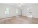 Bright main bedroom with ample sunlight, neutral paint, large closet, and attached bath at 1209 Maple Ave, Apex, NC 27502