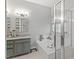 Modern bathroom featuring a soaking tub, glass shower, and a stylish vanity at 123 Chimney Rise Dr, Cary, NC 27511