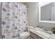 Neutral bathroom featuring a vanity with granite countertop and a shower with a fun marine life shower curtain at 123 Chimney Rise Dr, Cary, NC 27511