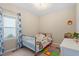 Bright bedroom with a single bed, area rug and a large window offering natural light at 123 Chimney Rise Dr, Cary, NC 27511