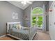 Bright bedroom with vaulted ceilings, a large window, and playful basketball hoop at 123 Chimney Rise Dr, Cary, NC 27511
