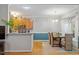 Cozy dining area adjacent to the kitchen featuring neutral walls, an elegant light fixture, and bright window at 123 Chimney Rise Dr, Cary, NC 27511