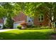 Attractive brick home featuring a well-manicured lawn and mature trees, offering great curb appeal at 123 Chimney Rise Dr, Cary, NC 27511