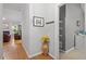 Hallway showcasing hardwood floors, light gray paint and access to the living room at 123 Chimney Rise Dr, Cary, NC 27511
