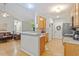 Bright kitchen features hardwood floors, granite countertops and stainless steel appliances at 123 Chimney Rise Dr, Cary, NC 27511