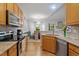 Modern eat-in kitchen with tile backsplash and an adjoining dining area at 123 Chimney Rise Dr, Cary, NC 27511
