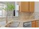 Close-up of the granite countertops and stainless steel sink with modern faucet at 123 Chimney Rise Dr, Cary, NC 27511