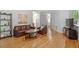 Spacious living room with hardwood floors, brown furniture, and an open floor plan at 123 Chimney Rise Dr, Cary, NC 27511