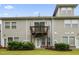 Exterior view of backyard featuring a wooden deck and lush landscaping at 127 Manordale Dr, Chapel Hill, NC 27517