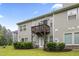 View of the backyard with a wooden deck and well-maintained lawn at 127 Manordale Dr, Chapel Hill, NC 27517