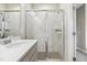 Bathroom showcasing a tiled shower with glass doors and modern fixtures at 127 Manordale Dr, Chapel Hill, NC 27517