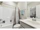 Bright bathroom with tub, shower, and white vanity at 127 Manordale Dr, Chapel Hill, NC 27517